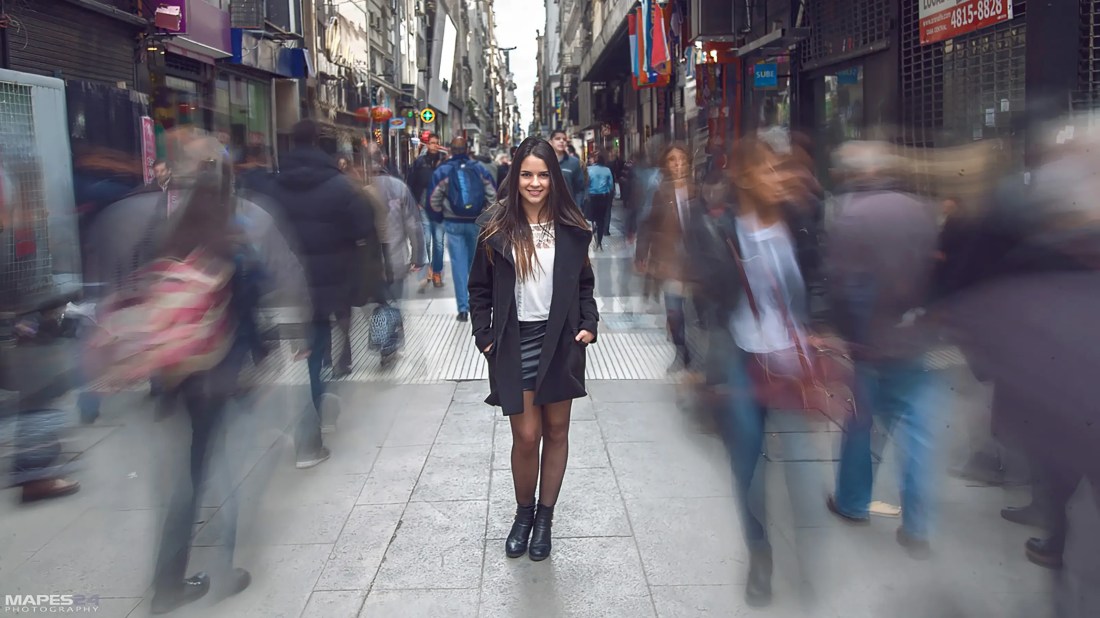 beautiful, trendy Colombian female model poses on Calle Florida in Buenos Aires, Argentina
