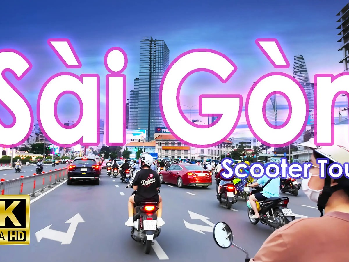 Scooter riders in busy traffic in Saigon, Ho Chi Minh City, Vietnam.
