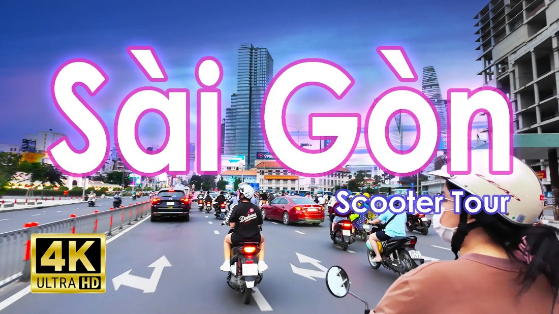 Scooter riders in busy traffic in Saigon, Ho Chi Minh City, Vietnam.