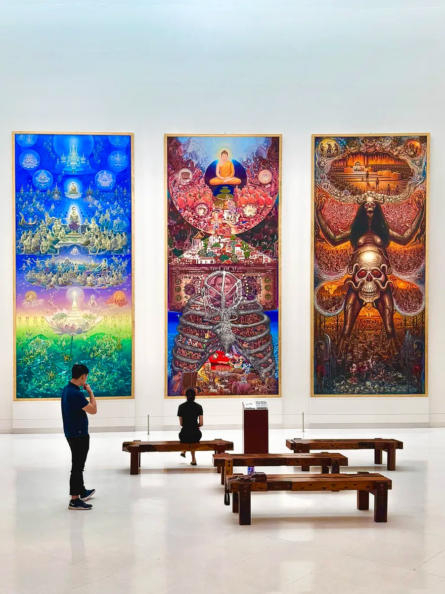 3 paintings of heaven, earth and hell by Sompop Budtarad, Panya Vijinthanasarn, and Prateep Kochabua called the three kingdoms